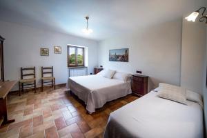 Un pat sau paturi într-o cameră la Albergo Fontanelle