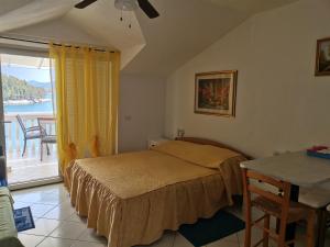 Postel nebo postele na pokoji v ubytování Villa Rosa