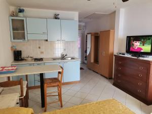 Kuchyň nebo kuchyňský kout v ubytování Villa Rosa