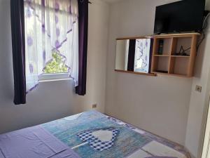 Postel nebo postele na pokoji v ubytování Villa Rosa