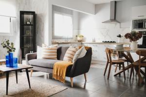 a living room with a couch and a table at Apartamento de La Candelaria II in Santa Cruz de Tenerife