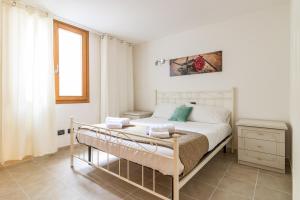 Postel nebo postele na pokoji v ubytování Apartment Gli Ulivi 4 - Tremezzina