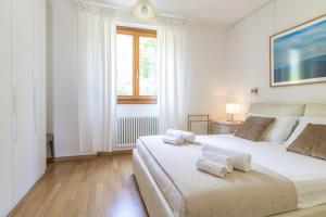 Postel nebo postele na pokoji v ubytování Apartment Gli Ulivi 4 - Tremezzina + 37 fotografií