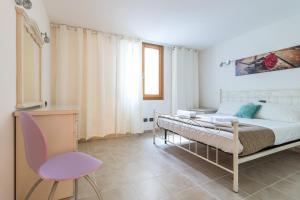 Postel nebo postele na pokoji v ubytování Apartment Gli Ulivi 4 - Tremezzina
