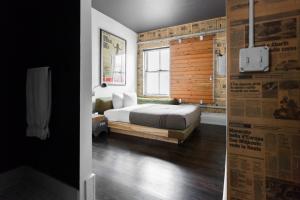 a bedroom with a bed and a window at Ace Hotel Portland in Portland