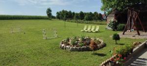 a garden with a soccer field and a goal at House Betty in Grabovac