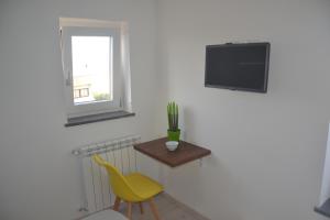 TV a/nebo společenská místnost v ubytování DC House