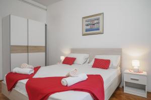 Postel nebo postele na pokoji v ubytování Apartments Ivka