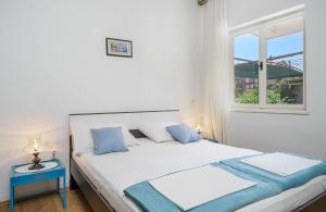 Postel nebo postele na pokoji v ubytování Apartments Ivka