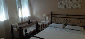 Postel nebo postele na pokoji v ubytování B&B Borgo Arcadia