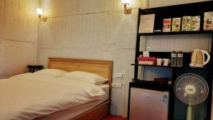 Postel nebo postele na pokoji v ubytování Kelly Field Homestay