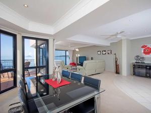 a living room with a couch and a table at Seaside Splendour 1 beautiful unit on the waterfront in Salamander Bay