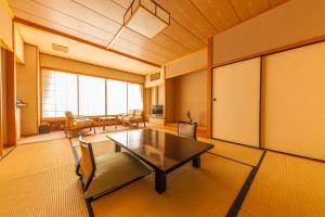 a living room with a table and chairs at Zazan minakami in Minakami