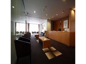 a waiting room with chairs and a reception desk at Court Hotel Fukuoka Tenjin - Vacation STAY 42330v in Fukuoka