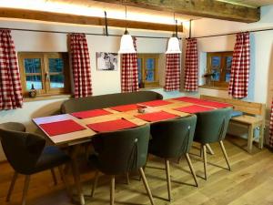 a dining room with a long table and chairs at Chalet Dürrfeld ***** in Viechtach