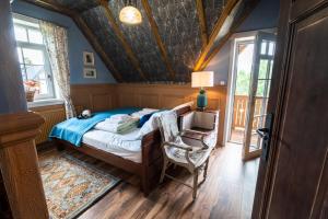 a bedroom with a bed and a table and a chair at Milkowa Dolina in Szklarska Poręba +123 photos