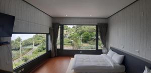 Katil atau katil-katil dalam bilik di Green incense Homestay