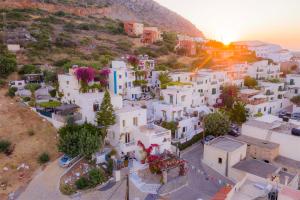 an aerial view of a town with white buildings at Step into a world of nature One Room Private Suite shared pool in Hersonissos