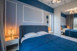 Posteľ alebo postele v izbe v ubytovaní Apartament Mimbelli