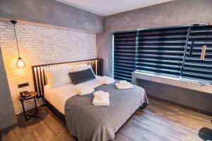 A bed or beds in a room at Project 3 Urban Chic Hotel