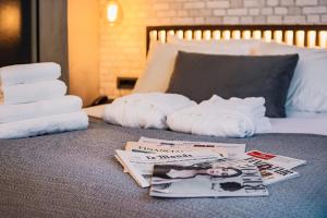 A bed or beds in a room at Project 3 Urban Chic Hotel