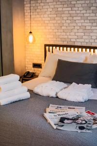 A bed or beds in a room at Project 3 Urban Chic Hotel