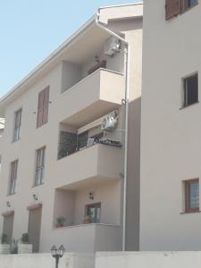 a building with balconies on the side at Jovan Vukovic in Kotor