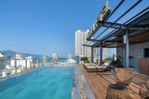 a swimming pool on the roof of a building at Adela Boutique Hotel - Infinity Pool in Da Nang