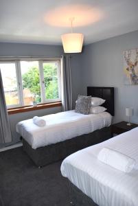 Postel nebo postele na pokoji v ubytování Kelpies Serviced Apartments- Jamieson