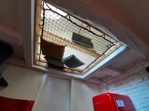 TV a/nebo společenská místnost v ubytování Gîte - L'atelier au 19