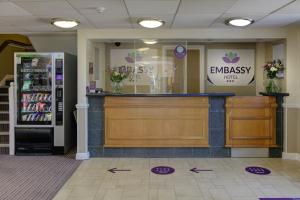 a cash counter in a store with a refrigerator at Embassy Hotel, Gateshead Newcastle, Sure Hotel Collection by Best Western in Newcastle upon Tyne