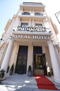 a hotel with a red carpet in front of a hotel at Royal Casino & Hotel in Batumi