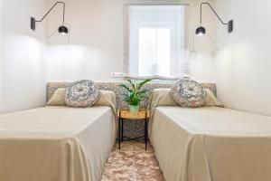 Posteľ alebo postele v izbe v ubytovaní Genteel Home Recogidas
