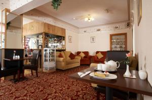 a living room with a couch and a table at The Bayridge Guest House in Bridlington