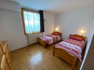 Postel nebo postele na pokoji v ubytování DOMUS ALPINA