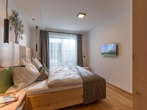 Ein Bett oder Betten in einem Zimmer der Unterkunft Martin Feyersinger