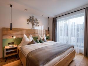 Ein Bett oder Betten in einem Zimmer der Unterkunft Martin Feyersinger