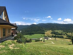 a view of the mountains from a house at Babiakówka in Kluszkowce