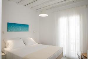 Posteľ alebo postele v izbe v ubytovaní Nireas Apartments Mykonos Downtown