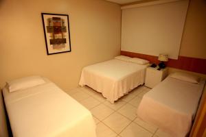 Кровать или кровати в номере Hotel Talissa 2