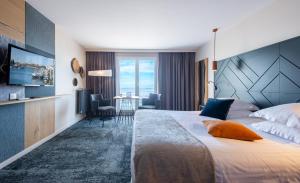 Кровать или кровати в номере Hotel Atlantic