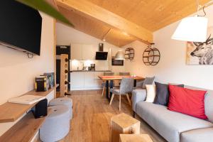 Televízia a/alebo spoločenská miestnosť v ubytovaní Kreischberg Suites by ALPS RESORTS