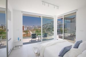a bedroom with a bed and a large window at Villa Olivine Pearl 3 in Protaras +30 photos