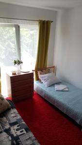 Cama ou camas em um quarto em Willa Tanagra