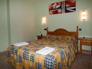 En eller flere senger på et rom på Hostal La Maravillosa