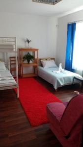 En eller flere senge i et værelse på Tanagra-villa + 14 billeder