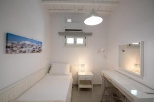 Posteľ alebo postele v izbe v ubytovaní Nireas Apartments Mykonos Downtown