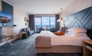 Кровать или кровати в номере Hotel Atlantic