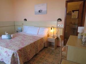 Кровать или кровати в номере Hotel Primula