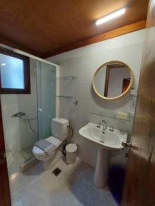 a bathroom with a toilet and a sink and a shower at Beautiful house wiht sea view in Samos Island in Koumeika